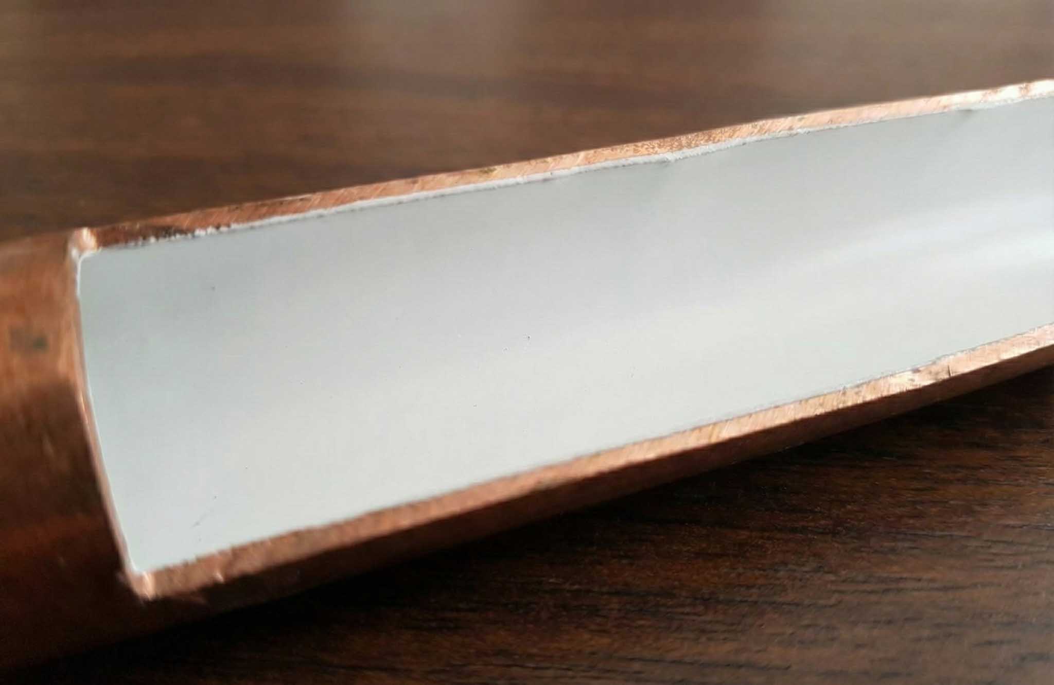 Pipe after ANMAC treatment — clean white protective coating